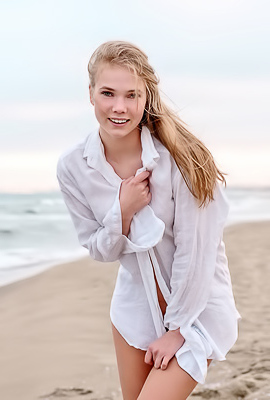 Luise Entices With A Beach Striptease Revealing Perky Nipples And Grabbing Her Curves